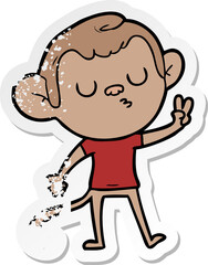 distressed sticker of a cartoon monkey