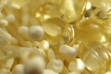 Mushroom or enoki close up macro, enokitake Flammulina velutipes. Capsules, dietary supplements.