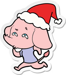 hand drawn sticker cartoon of a elephant remembering wearing santa hat