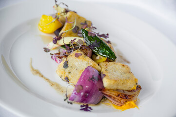 Expertly plated main course dish