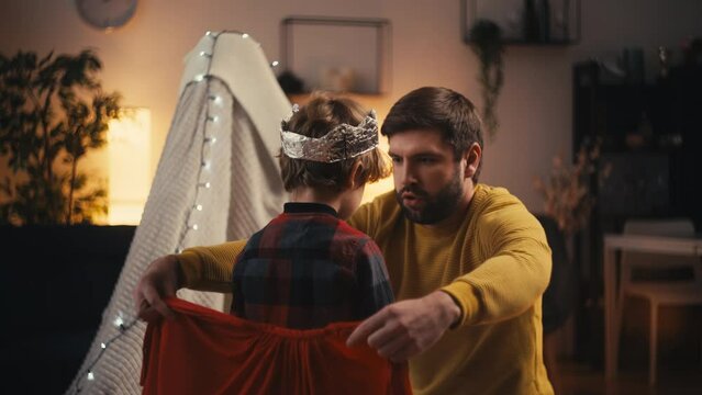 Little boy dressed aa a king spending time with father, leisure time, parenthood