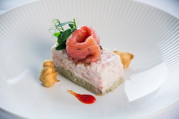 A fine dining prawn and salmon starter expertly plated