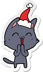 happy hand drawn sticker cartoon of a cat wearing santa hat