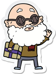 sticker of a cartoon curious man with beard sunglasses and present