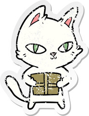 distressed sticker of a cartoon cat holding parcel