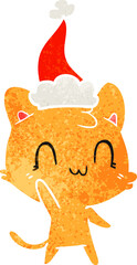 hand drawn retro cartoon of a happy cat wearing santa hat