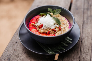 Avocado and banana smoothie bowl with nuts and granola. Healthy food for a healthy lifestyle.