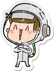 distressed sticker of a happy cartoon astronaut