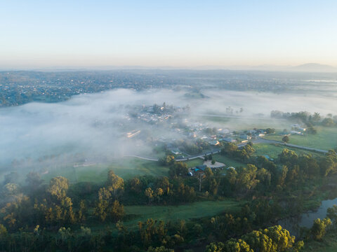 Morning mist covering landscape at sunrise at edge of Hunter Valley town of Singleton