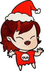 hand drawn textured cartoon of a laughing vampire girl wearing santa hat