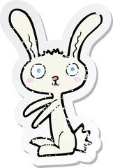 retro distressed sticker of a cartoon rabbit