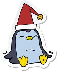 sticker of a cartoon penguin wearing christmas hat