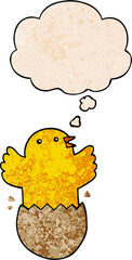 cartoon hatching bird with thought bubble in grunge texture style