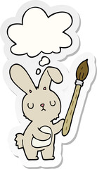 cartoon rabbit with paint brush with thought bubble as a printed sticker
