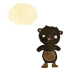 cartoon teddy black bear wearing boots with thought bubble