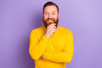 Portrait of young virile man touch his beard red hair posing cadre barber shop thinking business plan isolated on purple color background