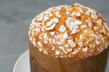 Easter cake with sugar powder on gray background