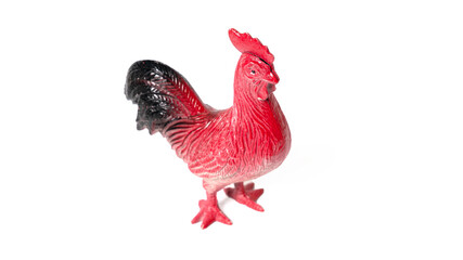 Toy rooster isolated on white background. Beautiful bright plastic toy rooster.