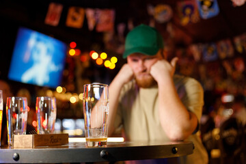 bearded man ran out of beer in pub