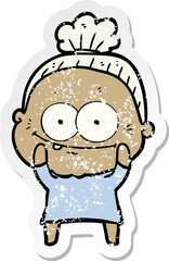 distressed sticker of a cartoon happy old woman