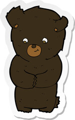 sticker of a cute cartoon black bear