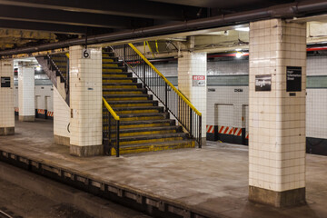 Old grimey staircase leading to underground subway station - 595939402