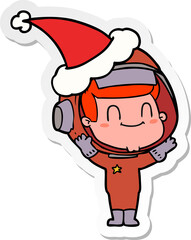 happy hand drawn sticker cartoon of a astronaut man wearing santa hat