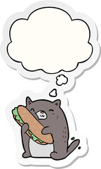 cartoon cat with sandwich with thought bubble as a printed sticker