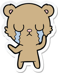 sticker of a crying cartoon bear
