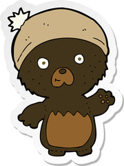 sticker of a cartoon cute teddy bear in hat