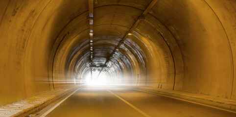 Highway road tunnel with car light