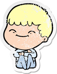 Obraz premium distressed sticker of a cartoon smiling boy