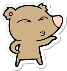 sticker of a cartoon whistling bear