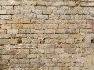 Textured stone sandstone surface. Close up image bricks