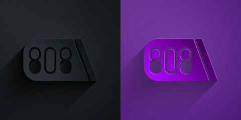Paper cut Drum machine music producer equipment icon isolated on black on purple background. Paper art style. Vector
