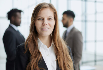 Beautiful business woman looking straight ahead with a smile