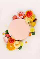 Wedding decoration circle for logo of new family. Celebration invitation, birthday party, han party. Pastry poster or cover decorated with macarons and kumquat. Bright summer greeting card 