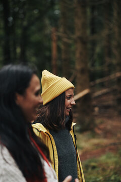 Woman laughing while hiking with friends
