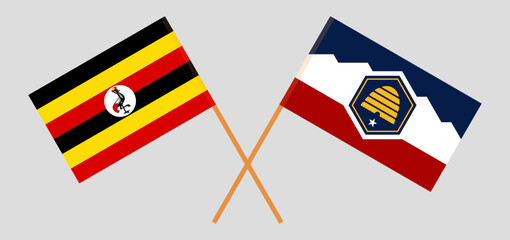 Crossed flags of Uganda and The State of Utah. Official colors. Correct proportion