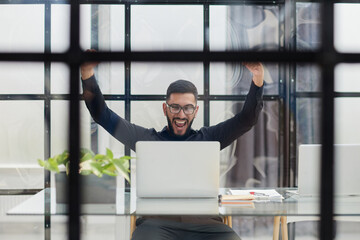 Business man sitting at his desk in the office