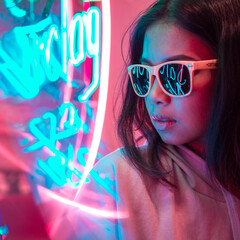 Lonely y2k girl sitting in a retro diner with colorful neon signs eating dinner wearing yellow sunglassess