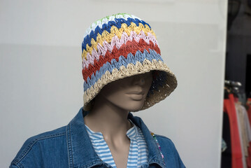 Closeup of summer hat on the head of mannequin in a fashion store showroom