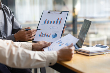 Financial advisory businessman meeting, discuss financial charts in business report and analyze investment plan strategies in the market.