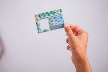 Hand holding driver's license. Brazilian document.
