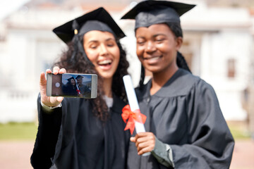 These are the memories well cherish forever. Closeup shot of two young women taking selfies on...