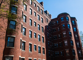 Brick apartment buildings and rental units in Cambridge, Massachusetts.