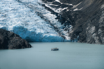 View of Portage glacier in the Chugach mountains and Portage lake on the background and pink...