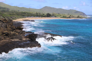 Fototapeta na wymiar landscape with mountains, clouds, beaches, sky, and orange skies of beautiful Hawaii