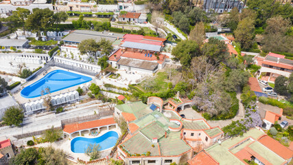 Fototapeta premium Aerial view of Posillipo district in the city of Naples, Campania, Italy. The area is full of hotels, bed and breakfast and luxury villas.