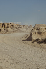 Fototapeta na wymiar Sandy desert road in bardenas reales
